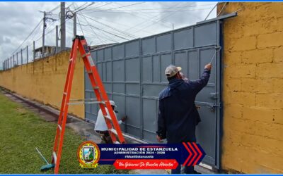 REMOZAMIENTO DE PINTURA A LAS PUERTAS DEL ESTADIO